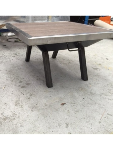 Catten Industries factory manufacturing fire pit with ModWood Black Bean table top work in progress